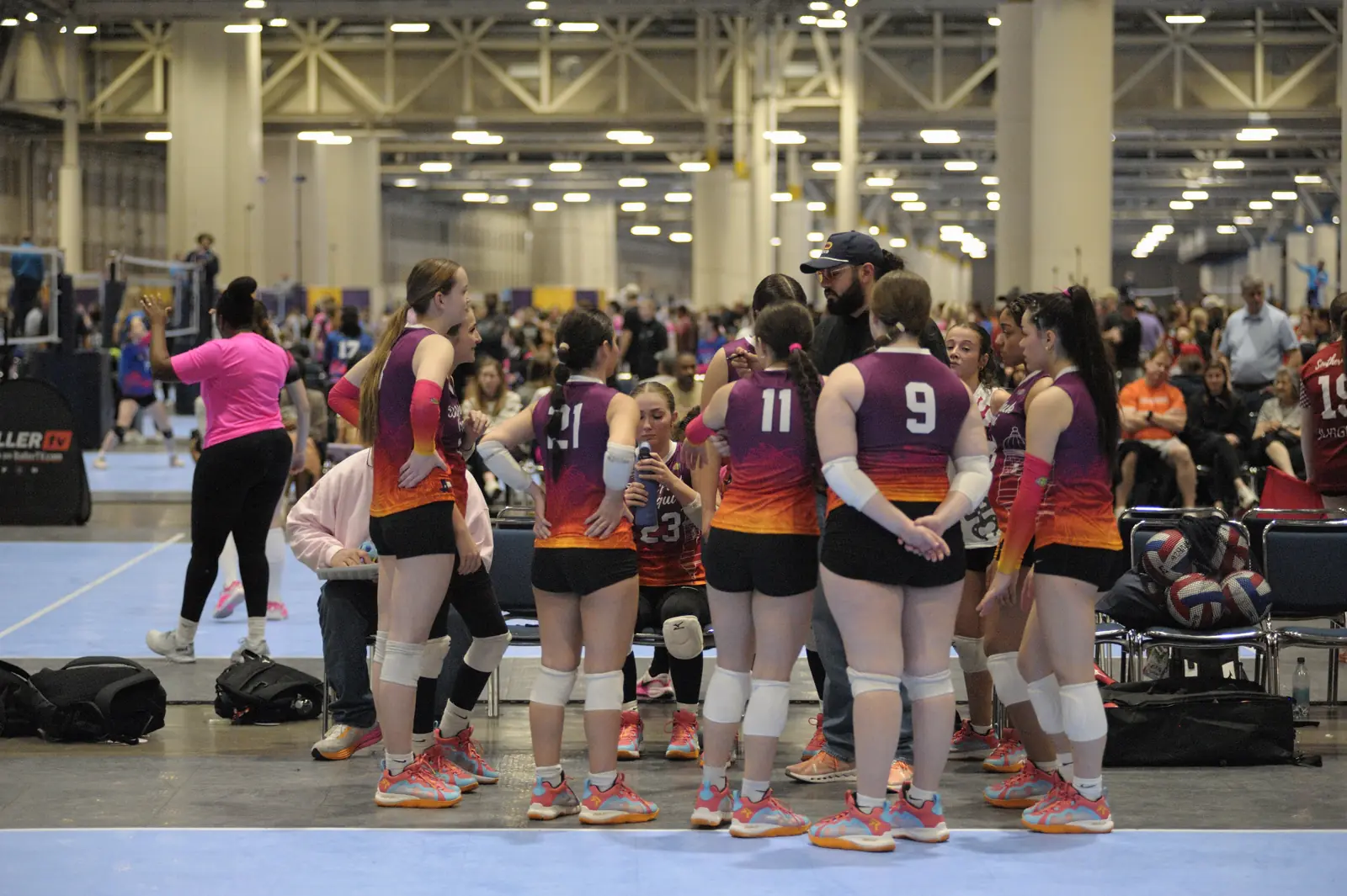 A Wolfpack Coquí team lines up at a large tournament hall